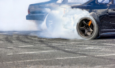 Race drift car burning tires on speed track © toa555