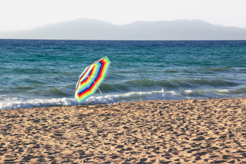 Colorful umbrella in the beach ,Colorful umbrella like symbol of LGBT community , background sea...