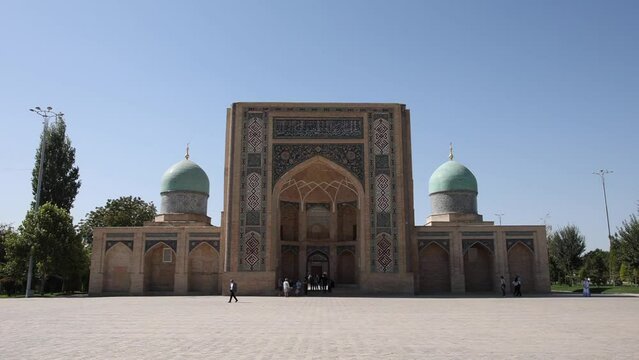 Autumn, 2022 - Tashkent, Uzbekistan - Khazret Imam Religious Complex. People walk along the main sights of Tashkent. Muslim mosque. Old brick walls of the mosque.