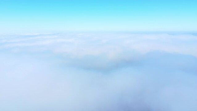 Aerial shot of the clouds in the blue sky
