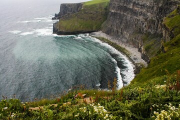 Aerial view of beautiful cliffs near the sea in Moher, Ireland