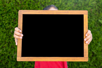 Hands holding blank slate