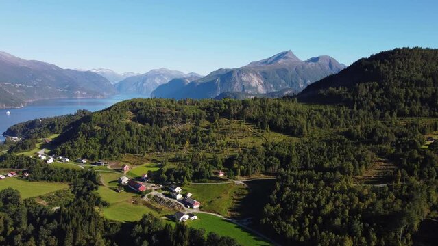 Drone view of the Stranda village surrounded by forests and mountains in Norway