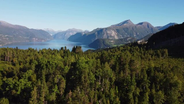 Drone view of the Stranda village surrounded by forests and mountains in Norway