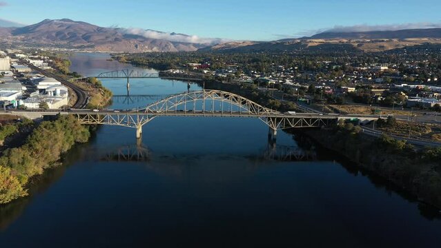Early Morning Aerial of the Columbia River in Wenatchee Washington - Bridge with Fog in Mountains