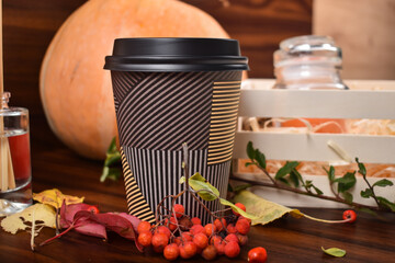 Cup of hot coffe in Fall scenery - obrazy, fototapety, plakaty