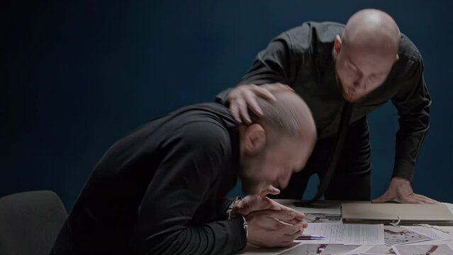 Police detective hits suspected criminal with his head on table. Interrogation without lawyer. Use of physical violence. Abuse of official authority. FBI agent is roughly forced to confess to crime