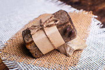 Piece of handmade soap with coffee beans. Spa concept for massage and relax.
