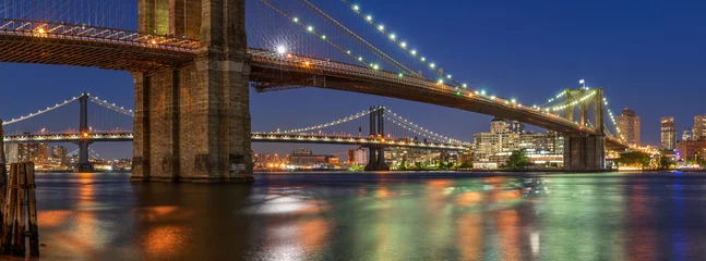 Fotobehang Evening panoramic view of the Brooklyn Bridge and Manhattan Bridge with East River. Dumbo, New York City © Francois Roux