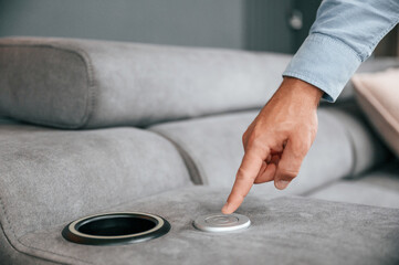 Trying automatic switches. Customer visiting the sofa and bed store. Looking for update