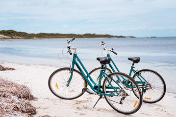Two bicycles parked on a beach on Rottnest Island, Western Australia. Bike rental for tourists....