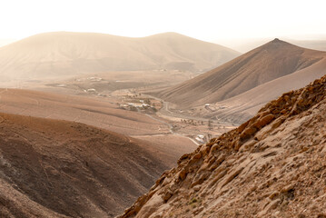 Scenic Aerial View of Town Between Desert and Volcanic Mountains in Fuerteventura,Canary Island
