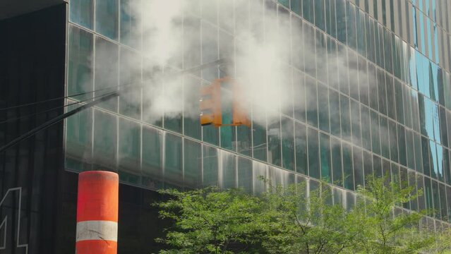 New York City, Manhattan, Stream comes out of a steam stack, traffic light,