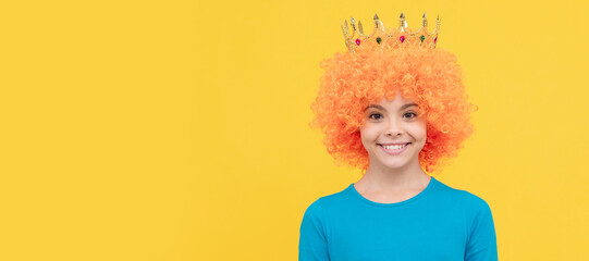 girls birthday party. happy funny kid in curly wig and crown. imagine herself a queen. Funny...