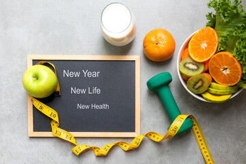 New Year for New Changes Healthy 2023.  Fresh vegetable fruits and healthy food for sport equipment...