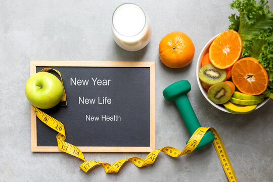 New Year for New Changes Healthy 2023.  Fresh vegetable fruits and healthy food for sport equipment for women diet slimming weight loss.  Healthy and Holiday Concept