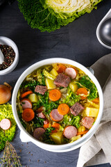 delicious savoy cabbage soup in white vase