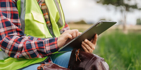 Farmer woman using digital tablet computer in field, technology application in agricultural growing activity, .