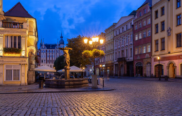 Fototapeta na wymiar Swidnica. Old medieval market square and colorful houses at dawn.