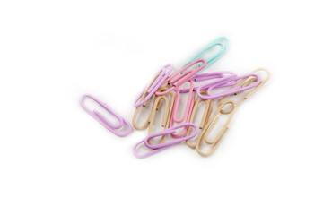 Multicolored paper clips close up isolated on white background. Stationery concept.