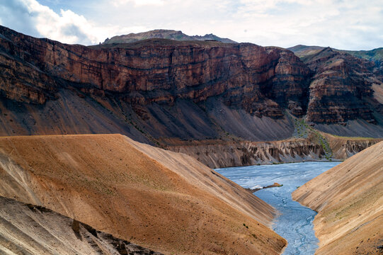 The scenic landscape of Spiti river valley with gully eroded and pinnacle weathered geological landform in the cold desert arid region of Trans Himalayas.