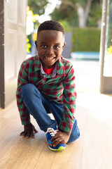 Portrait of happy african american boy looking at camera and smiling