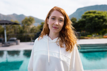 Portrait of happy caucasian woman smiling in garden