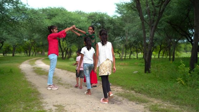 Asian student playing local game at garden. This concept can use for eduction, kid, student, work and teacher concept.
