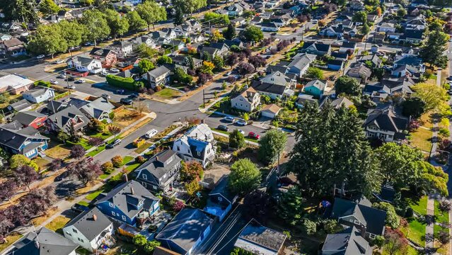 Hyperlapse footage of an aerial view fly-over of an American suburban neighborhood on a sunny day