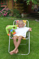 Cheerful boy playing with a toy
