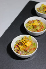 Mexican guacamole sauce with nachos chips