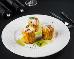 roasted corn on black background