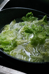 green vegetables are being soaked in clean water.  remove dirt and poisons. preparations before cooking.