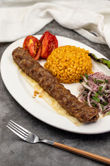 Adana kebab on dark background. Traditional Turkish kebab delicacies. close up