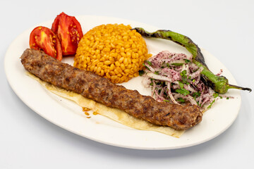 Adana kebab isolated on white background. Traditional Turkish kebab delicacies. close up