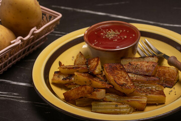 Salt-grilled potatoes with tomato sauce. Fast food restaurant