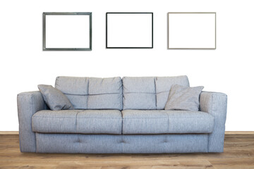 Interior of living room with sofa or couch furniture on wooden floor and three mockup art frames in PNG isolated on transparent background