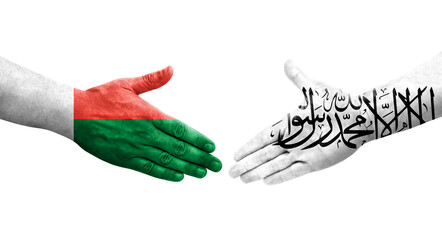 Handshake between Afghanistan and Madagascar flags painted on hands, isolated transparent image.