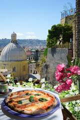 Pizzeria overlooking Naples city, Italy