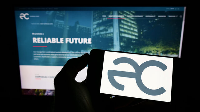 Stuttgart, Germany - 10-01-2022: Person holding cellphone with logo of Chilean company Empresas Copec SA on screen in front of business webpage. Focus on phone display.