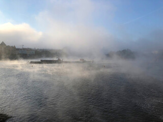 Fototapeta na wymiar Crazy mist and fog coming off the river 