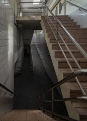 Bangkok, Thailand - Sep 30, 2022 : Stairs leading to interior view of public underpass with white...
