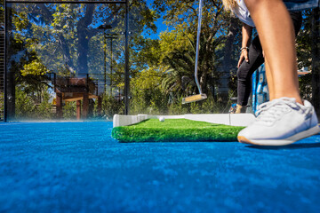 Girls playing mini golf. Seen from below.