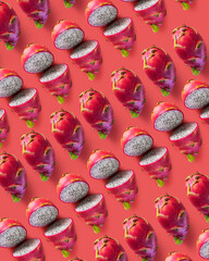 exotic fruit known as pitaya, seen from above with a pink background. In replay mode.