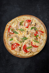 Marinara pizza with squid. mussels. shrimp, on a wooden round board