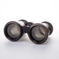 Antique binoculars on a white background