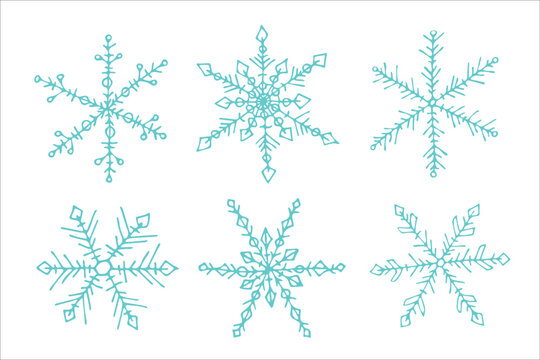 Set of cute hand drawn snowflakes. Christmas and New Year doodle clipart