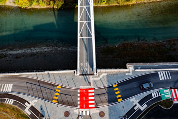 aerial view of bridge with bike path and road signs	