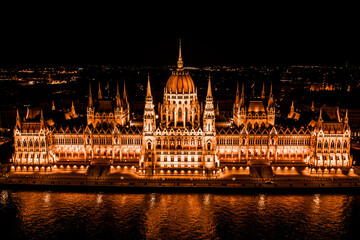 Fototapeta na wymiar Aerial Drone Photo - Hungarian Parliament Building lit up at night. Budapest, Hungary