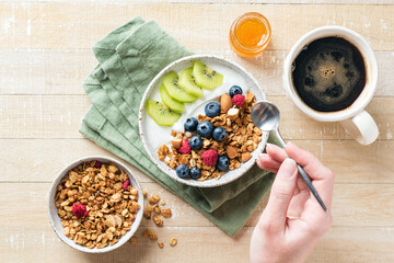 Granola yogurt bowl with fruits and berries for healthy breakfast
